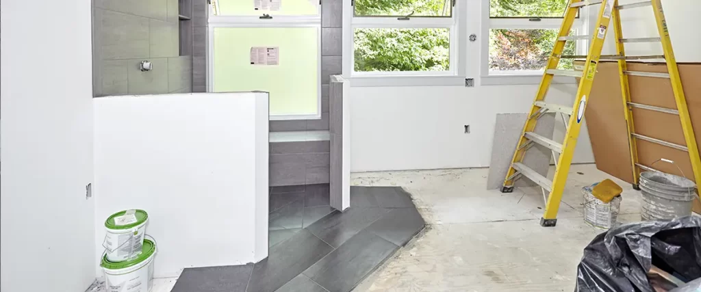 Bathroom remodeling project in progress with a custom walk-in shower and modern tile installation
