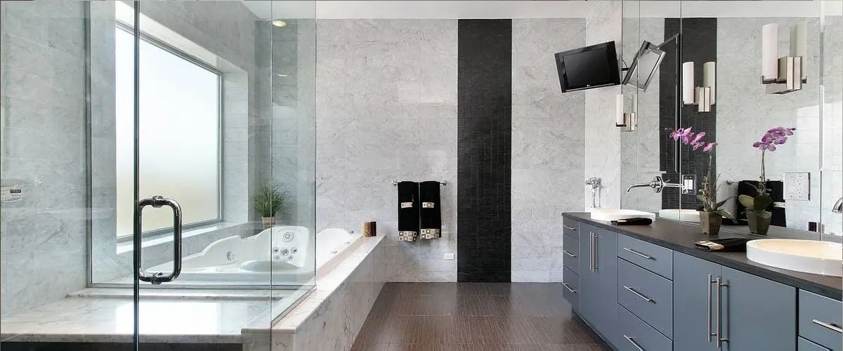 Luxury bathroom remodeling with double vanity, soaking tub, glass shower, and modern tile finishes